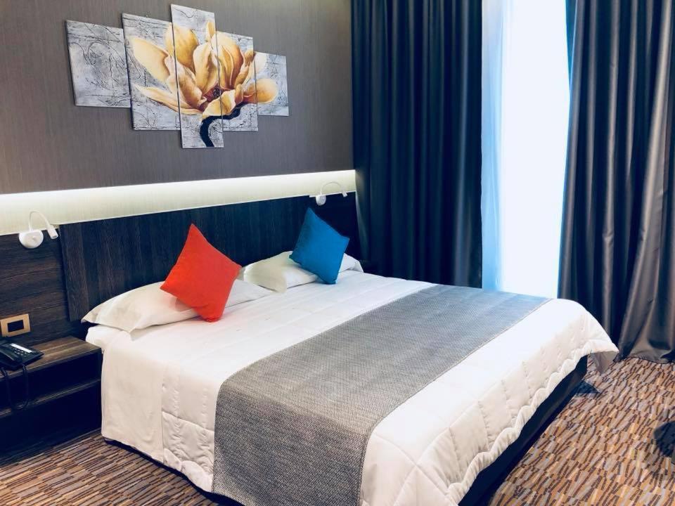 Postel nebo postele na pokoji v ubytování Hotel Enjoy