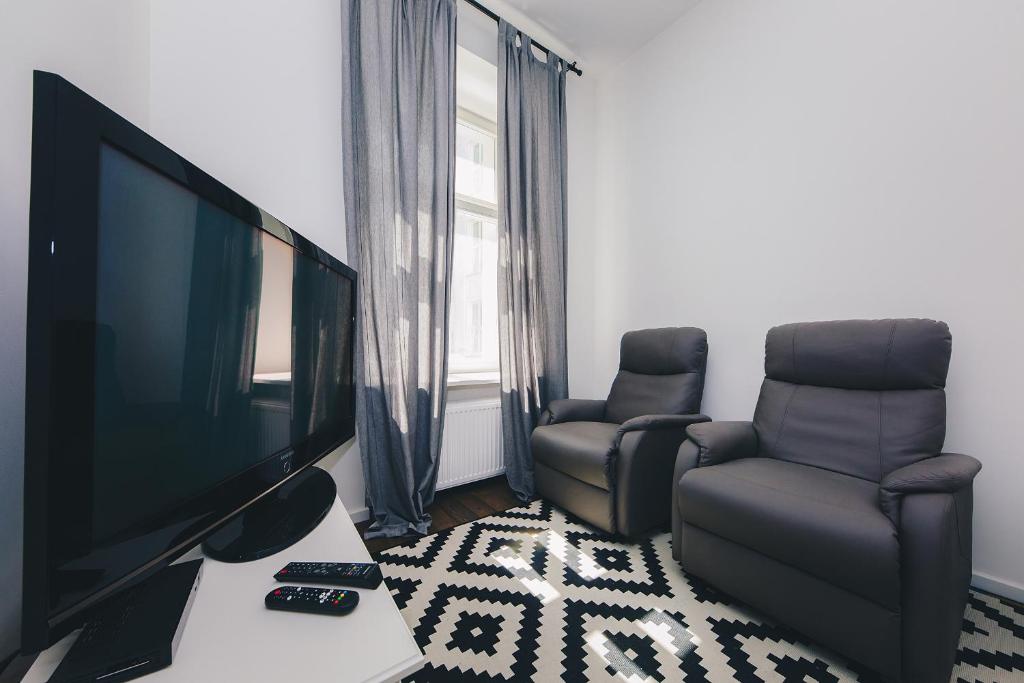 Televízia a/alebo spoločenská miestnosť v ubytovaní ShortStayPoland Noakowskiego (B30)