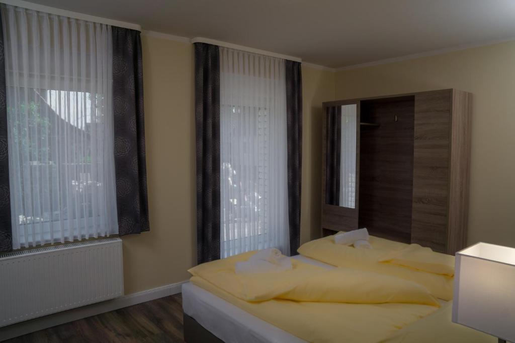 Postel nebo postele na pokoji v ubytování Hotel Dea