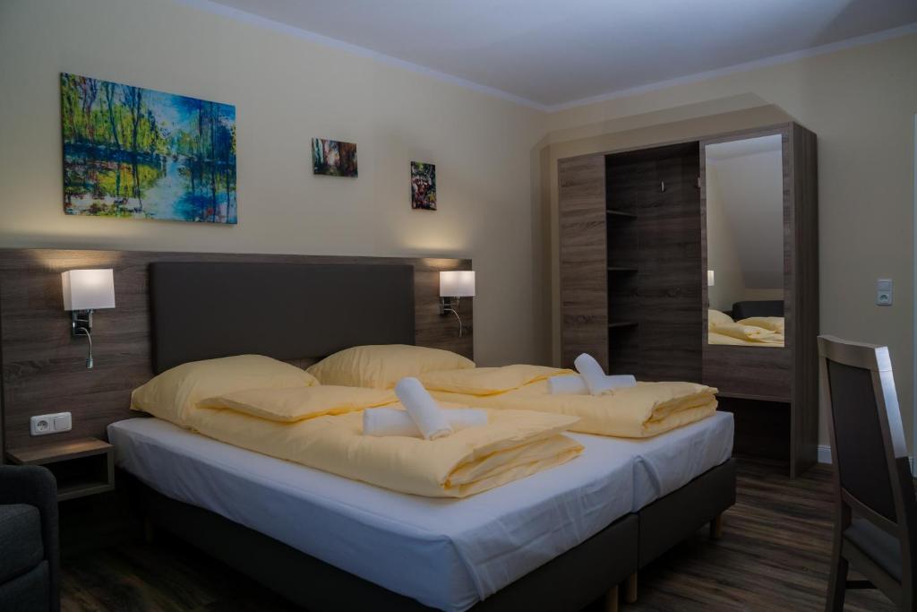 Postel nebo postele na pokoji v ubytování Hotel Dea