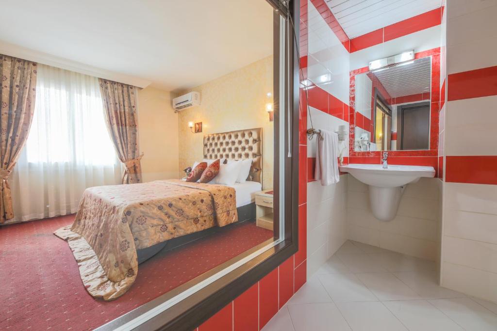 Postel nebo postele na pokoji v ubytování Hostapark Hotel