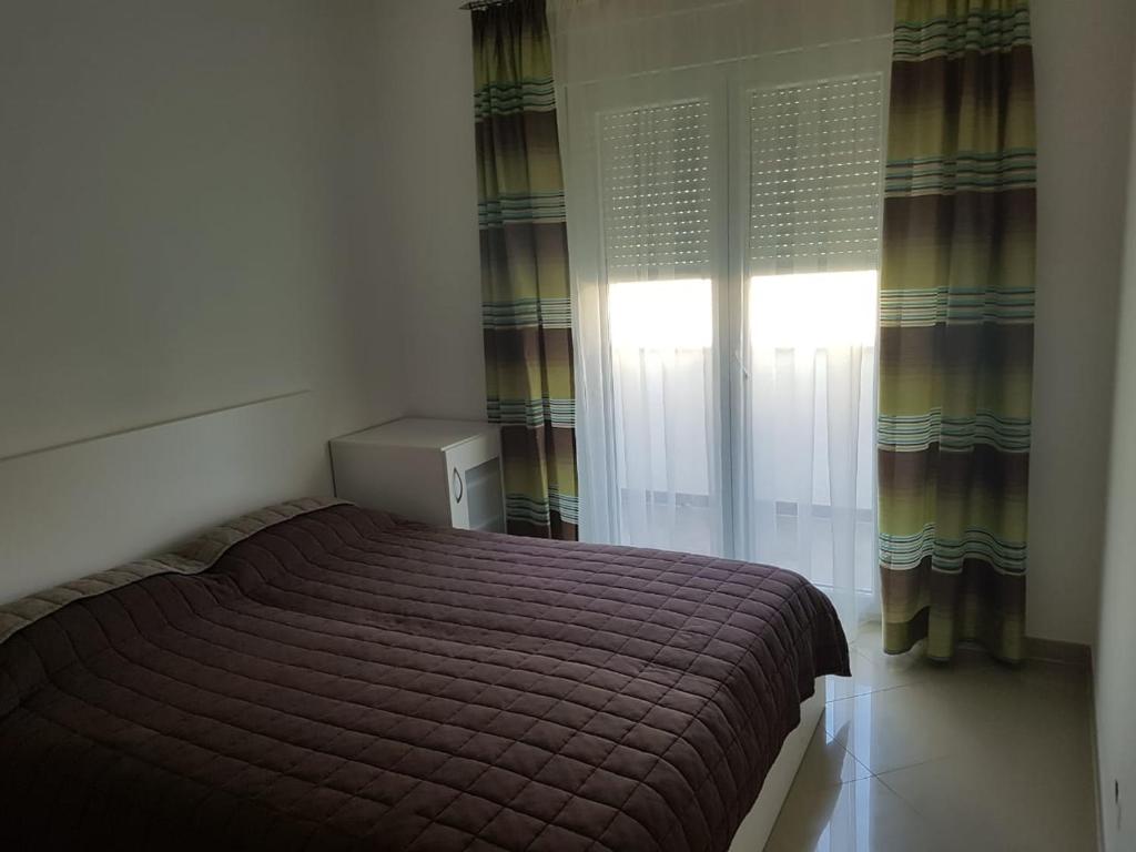 Posteľ alebo postele v izbe v ubytovaní Apartment Kozina