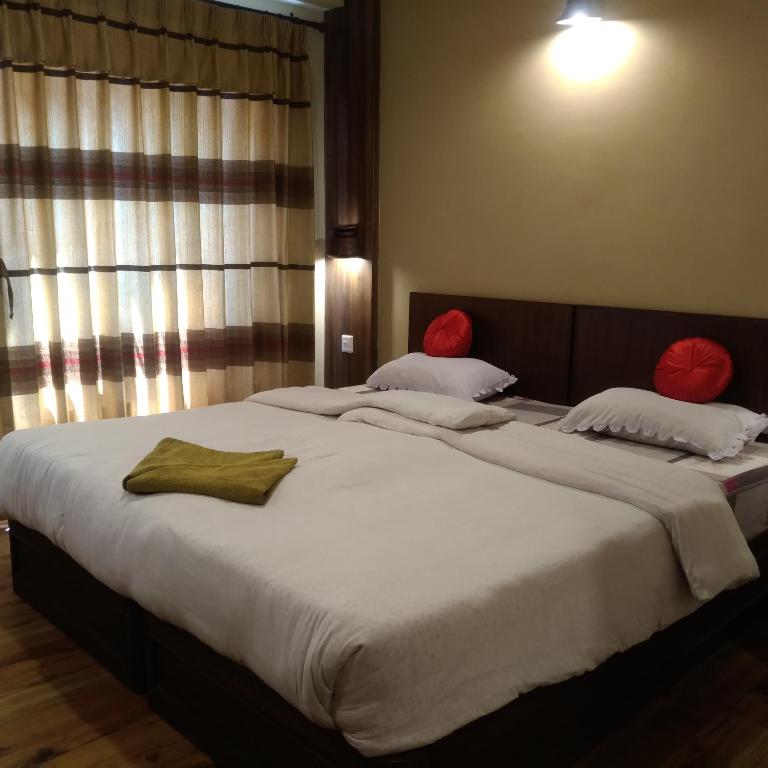 Postel nebo postele na pokoji v ubytování Kumari Guest House