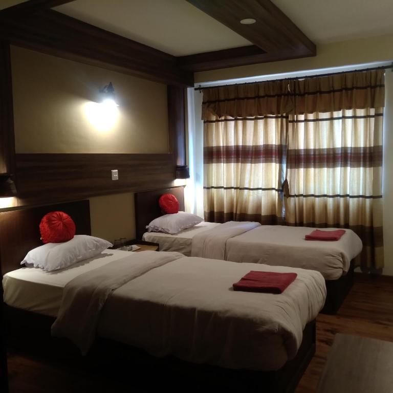 Postel nebo postele na pokoji v ubytování Kumari Guest House