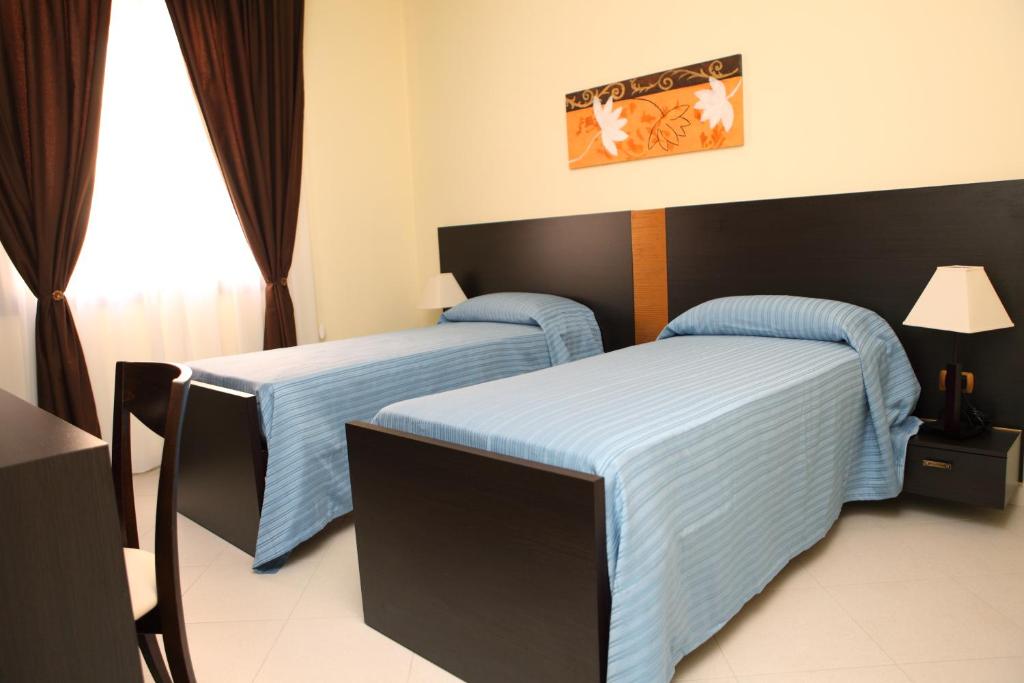 Postel nebo postele na pokoji v ubytování B&B Armony 111