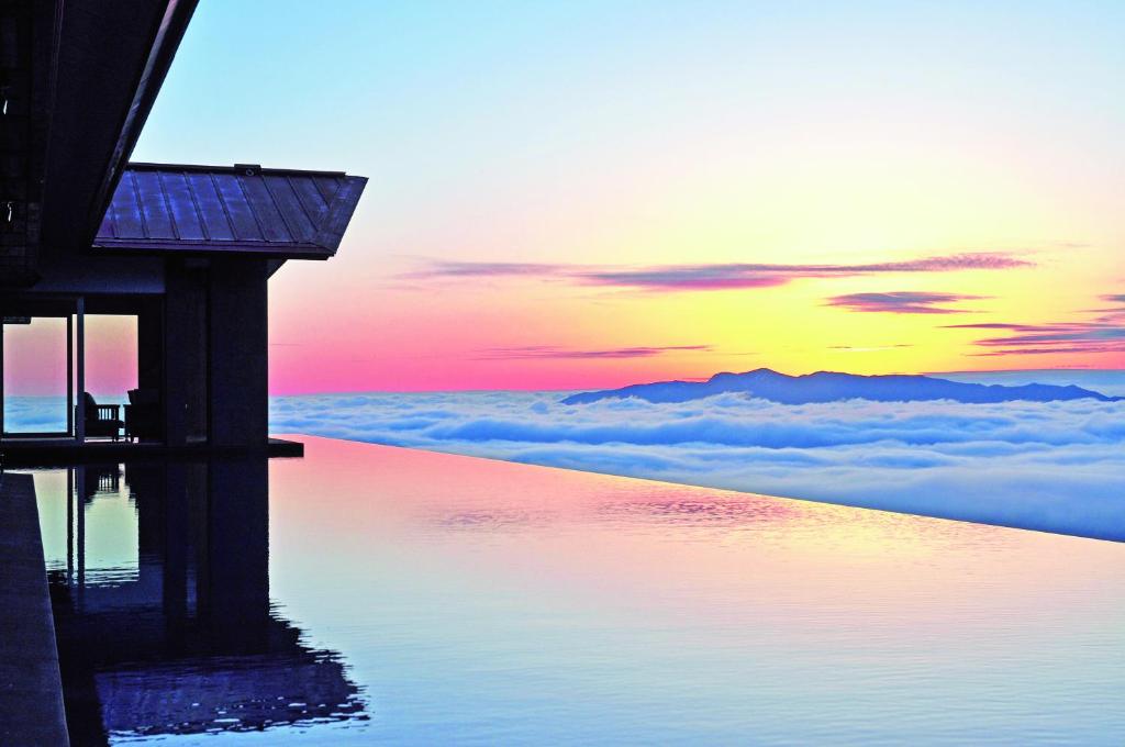 a view of the sunset from above the clouds at Akakura Kanko Hotel in Myoko