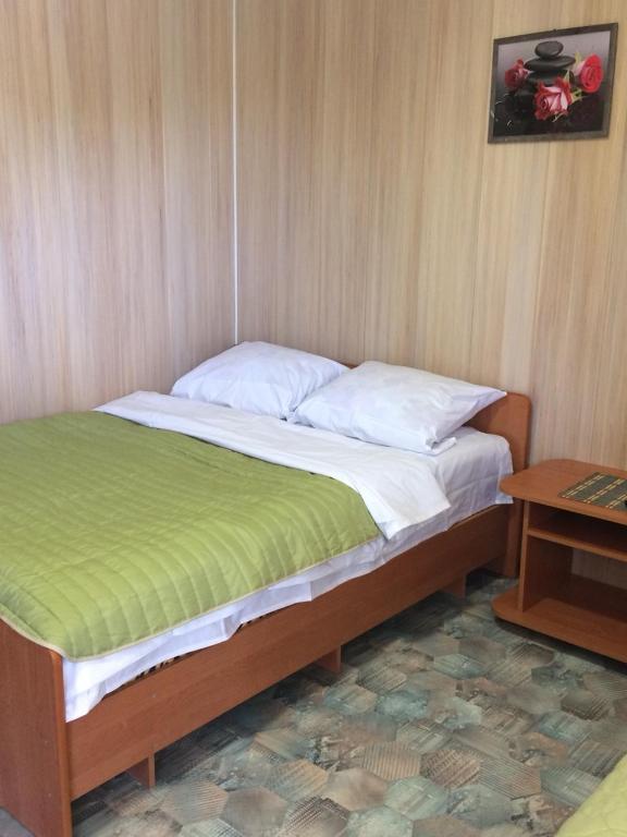 Postel nebo postele na pokoji v ubytování Дом семейного отдыха