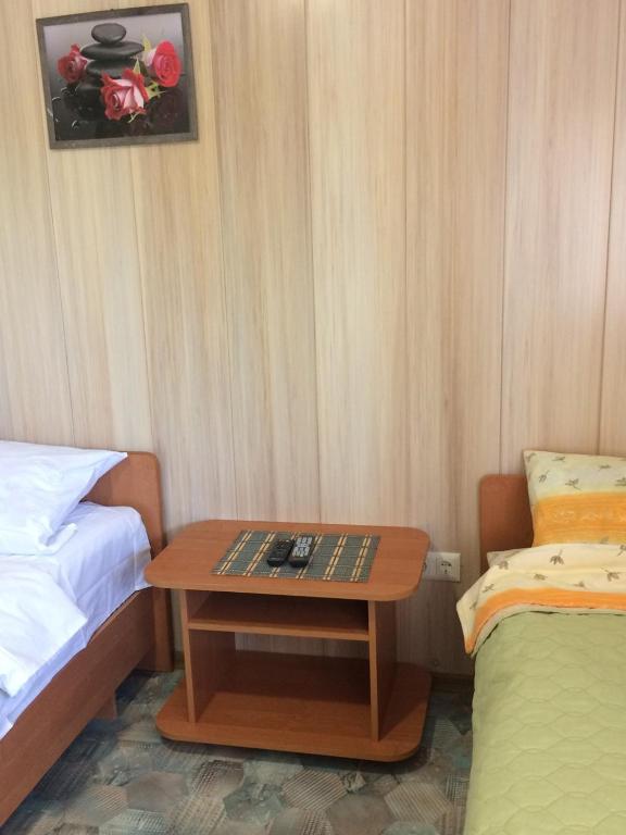 Postel nebo postele na pokoji v ubytování Дом семейного отдыха