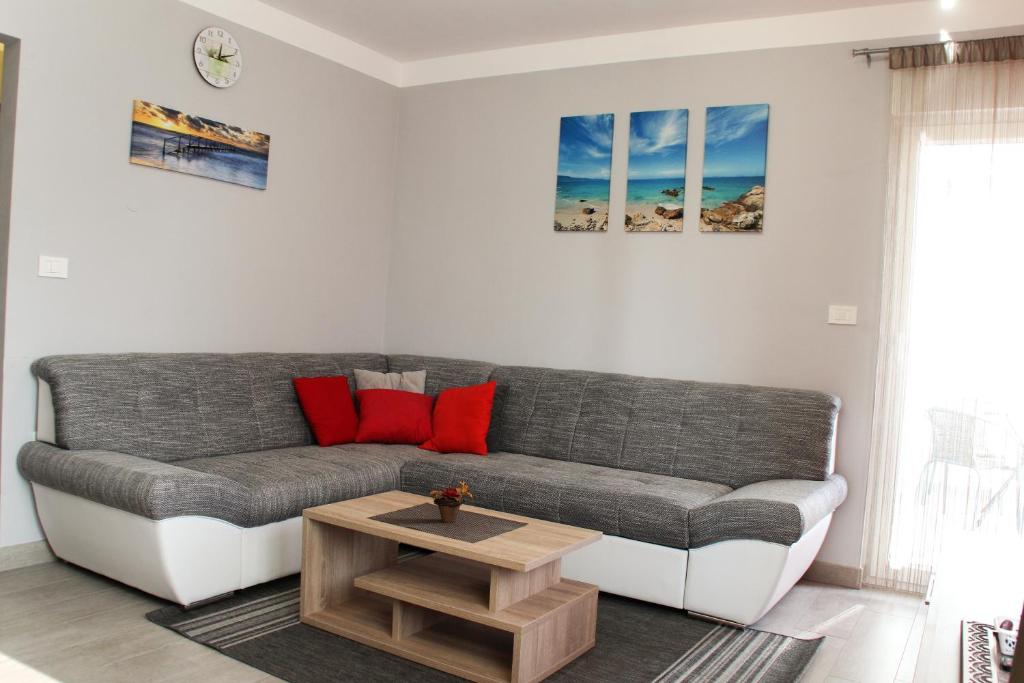 a living room with a couch and a coffee table at Apartment Ana in Rovinj