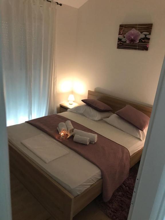 Postel nebo postele na pokoji v ubytování Sweet Apartments