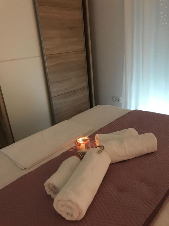 Postel nebo postele na pokoji v ubytování Sweet Apartments