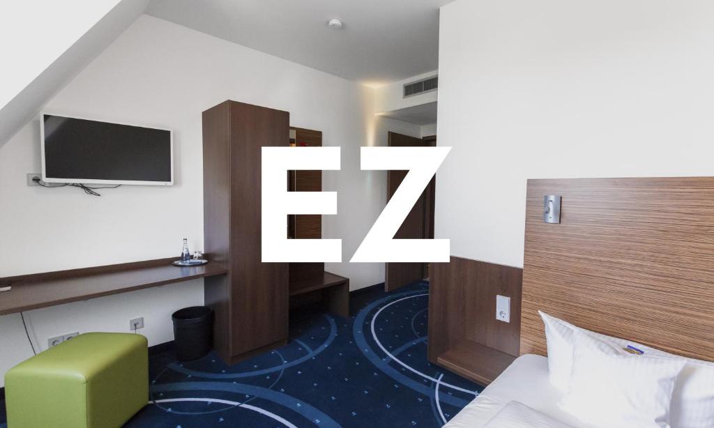 TV a/nebo společenská místnost v ubytování Hotel City Oase Lb