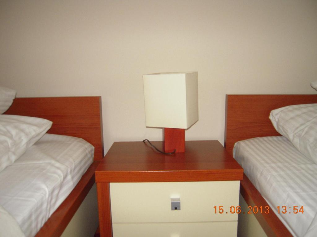 Postel nebo postele na pokoji v ubytování Dworek Opartowo
