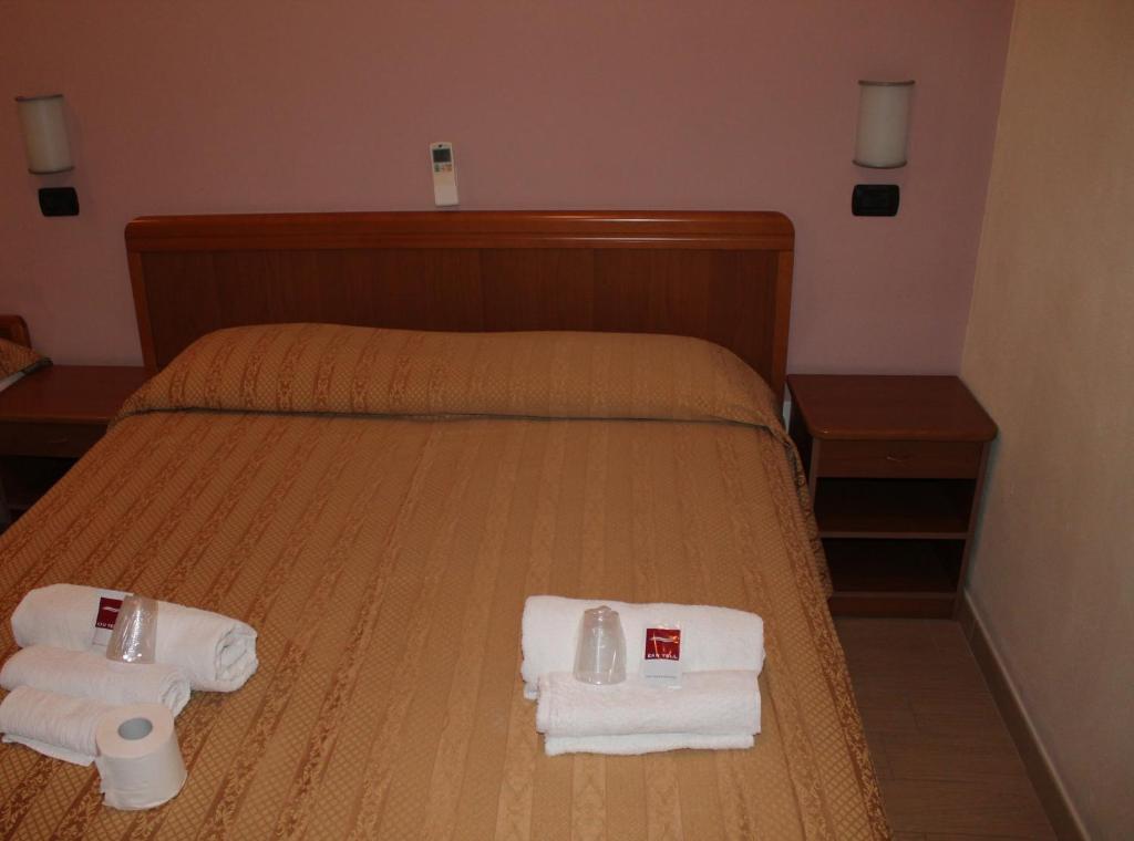 Postel nebo postele na pokoji v ubytování Hotel Oblio