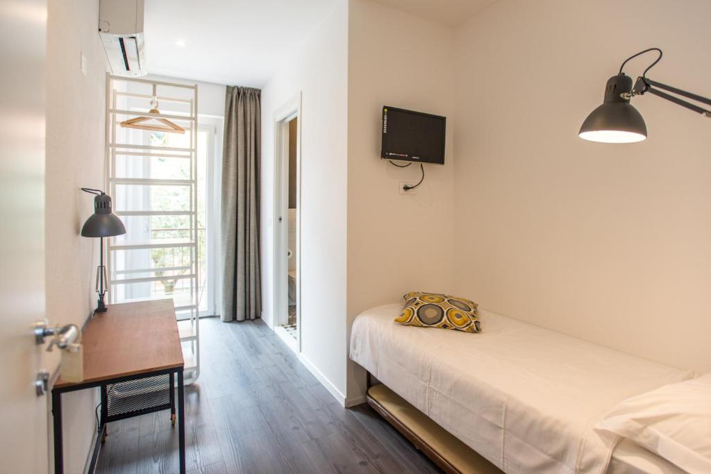 Postel nebo postele na pokoji v ubytování Hotel Villa Rina