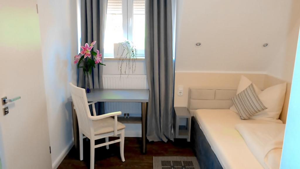 Postel nebo postele na pokoji v ubytování Hotel Stadt Soltau