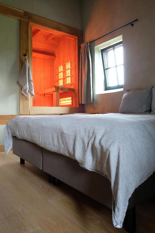 Postel nebo postele na pokoji v ubytování B&B de ZIL