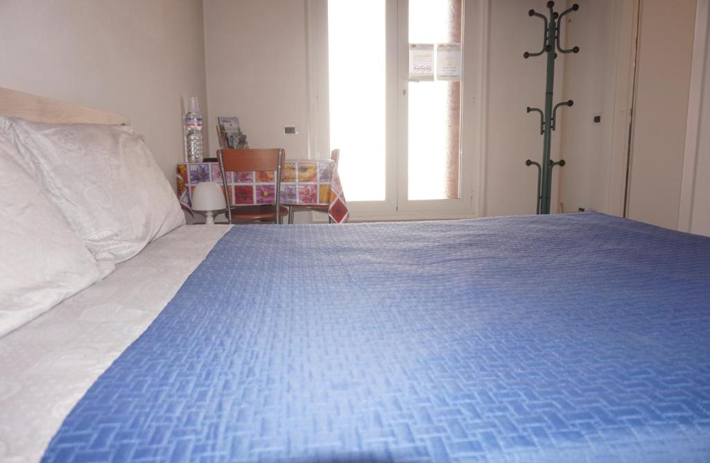 Postel nebo postele na pokoji v ubytování Bergamum F.L.