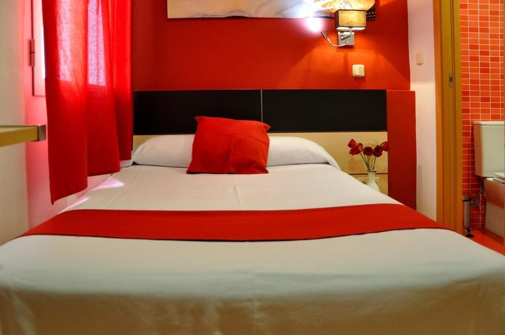 Cama o camas de una habitación en Hostal Falfes