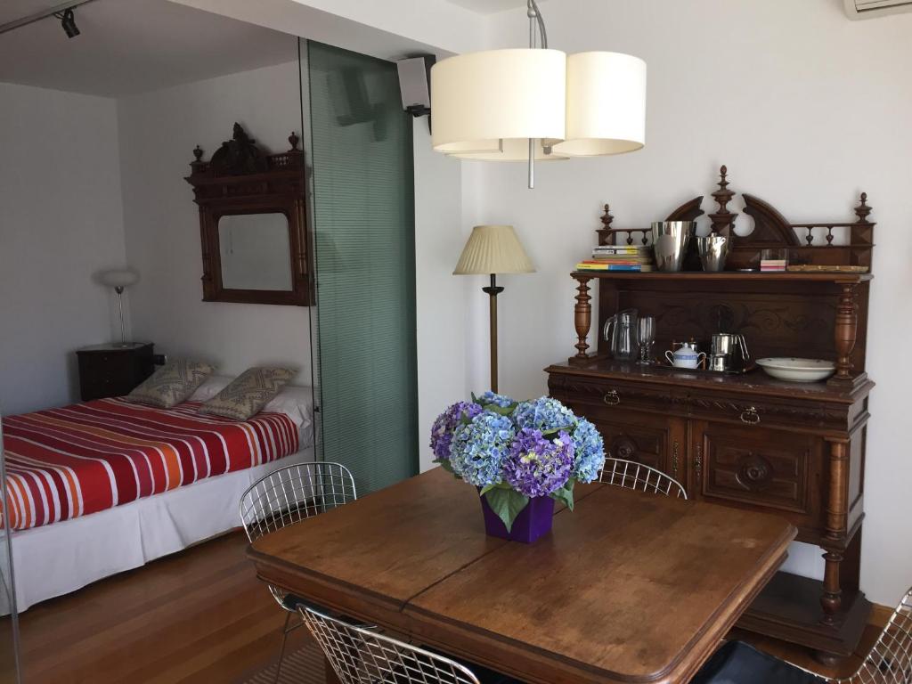 Posteľ alebo postele v izbe v ubytovaní Boulevard Apartmento