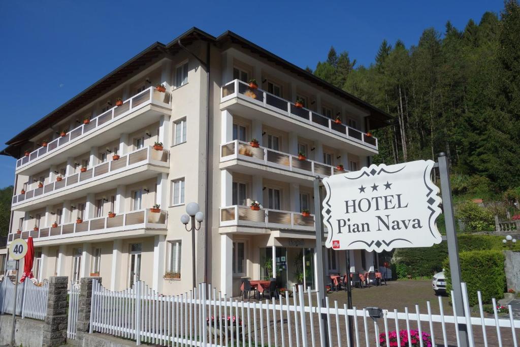 a hotel with a sign in front of a building at Hotel Pian Nava in Premeno