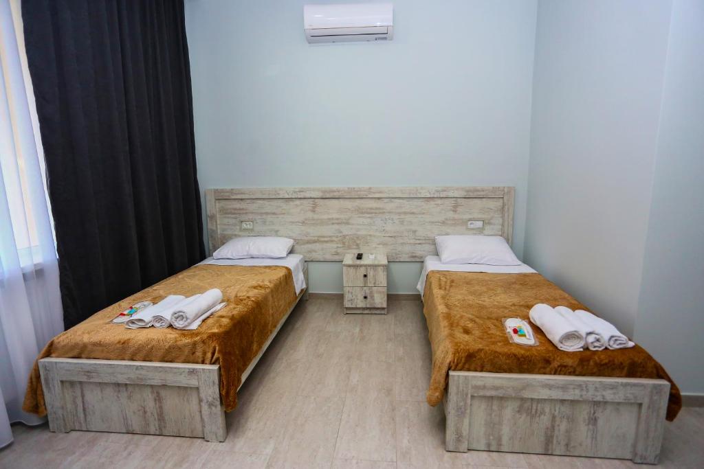 Postel nebo postele na pokoji v ubytování Hotel City Kutaisi