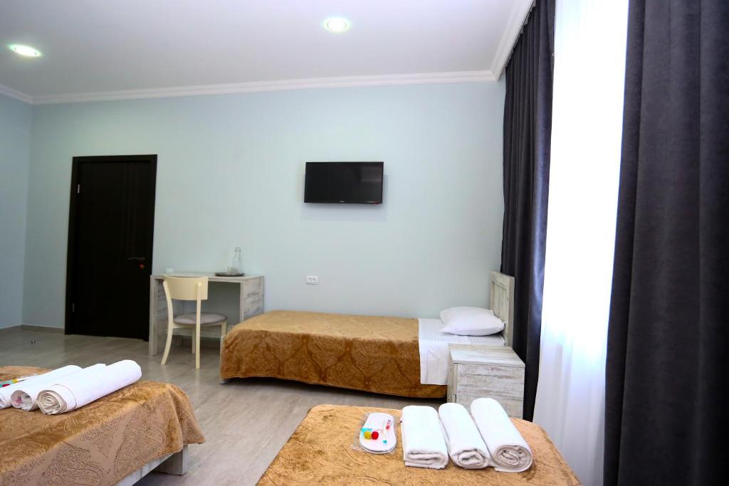 Postel nebo postele na pokoji v ubytování Hotel City Kutaisi