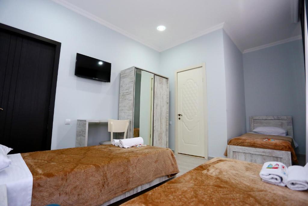 Postel nebo postele na pokoji v ubytování Hotel City Kutaisi