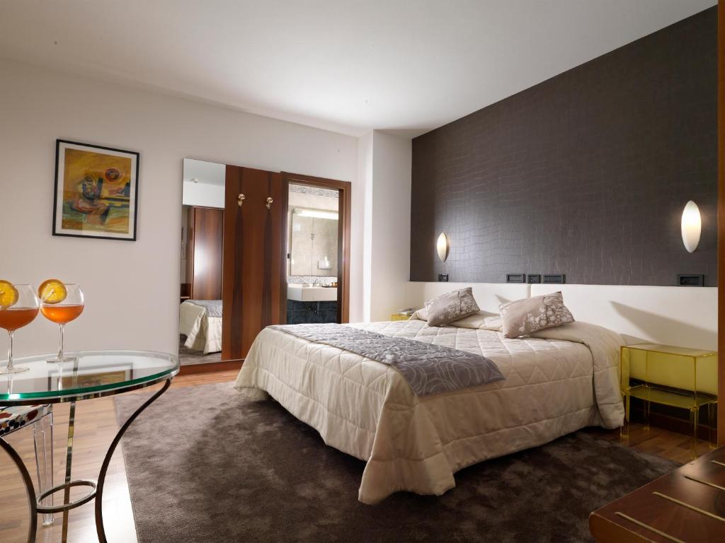 Postel nebo postele na pokoji v ubytování Hotel Al Pino Verde