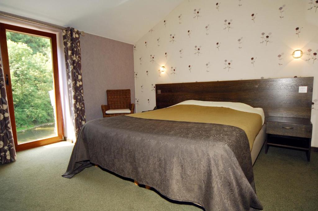 Postel nebo postele na pokoji v ubytování Hôtel/Restaurant à la Ferme