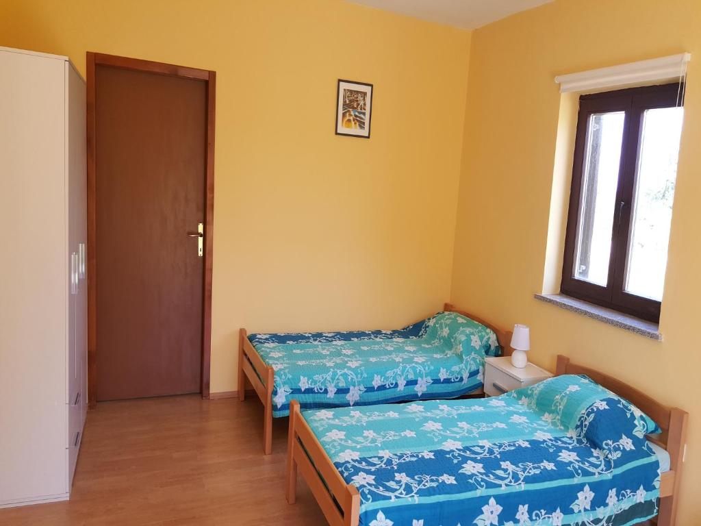 Postel nebo postele na pokoji v ubytování Apartment Stanko