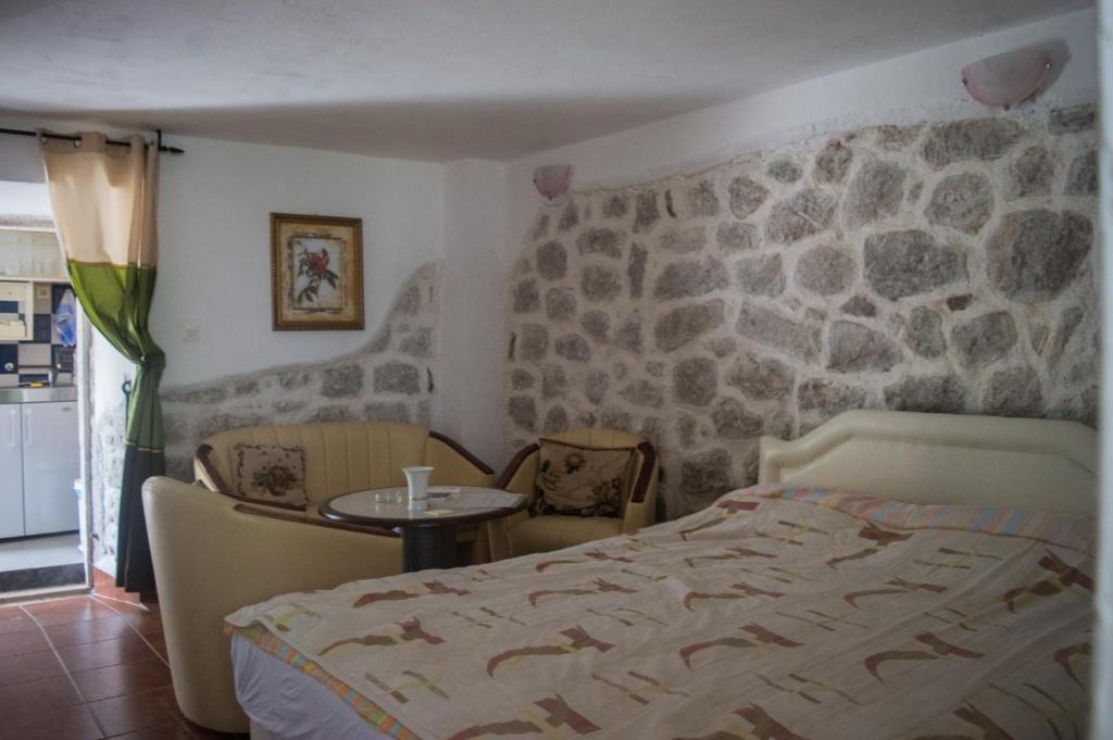 Postel nebo postele na pokoji v ubytování Apartments Subotic