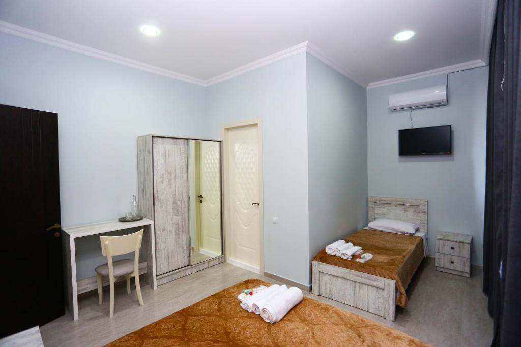 Postel nebo postele na pokoji v ubytování Hotel City Kutaisi