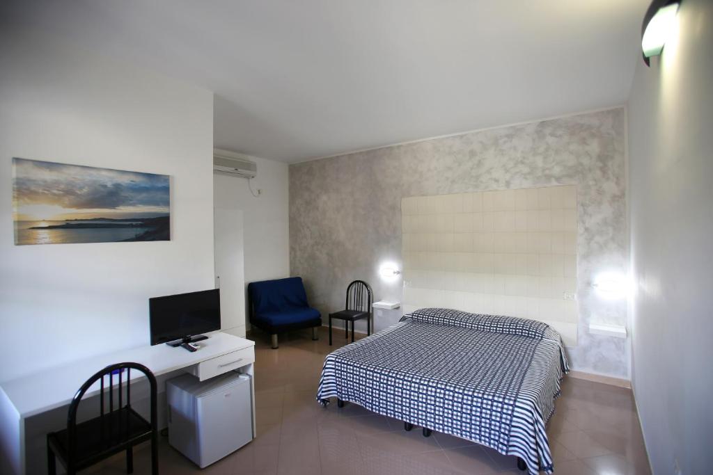Postel nebo postele na pokoji v ubytování Hotel Parco Carabella