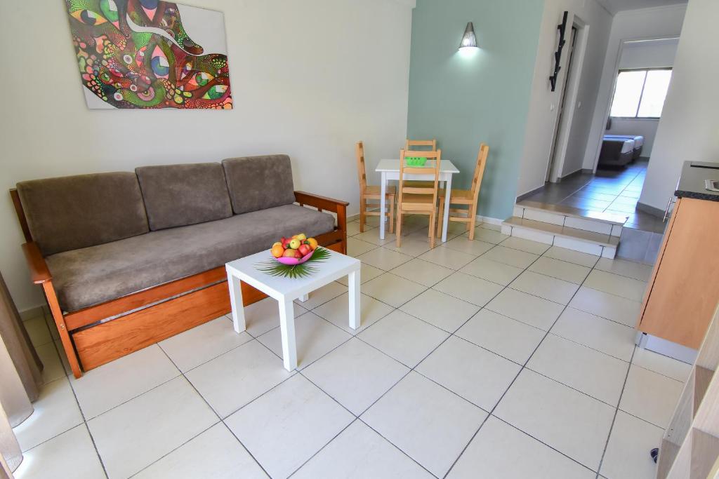 a living room with a couch and a table at Bayside Salgados in Albufeira