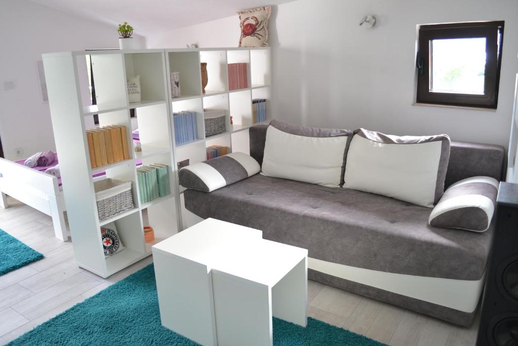 Postel nebo postele na pokoji v ubytování Apartments Niković