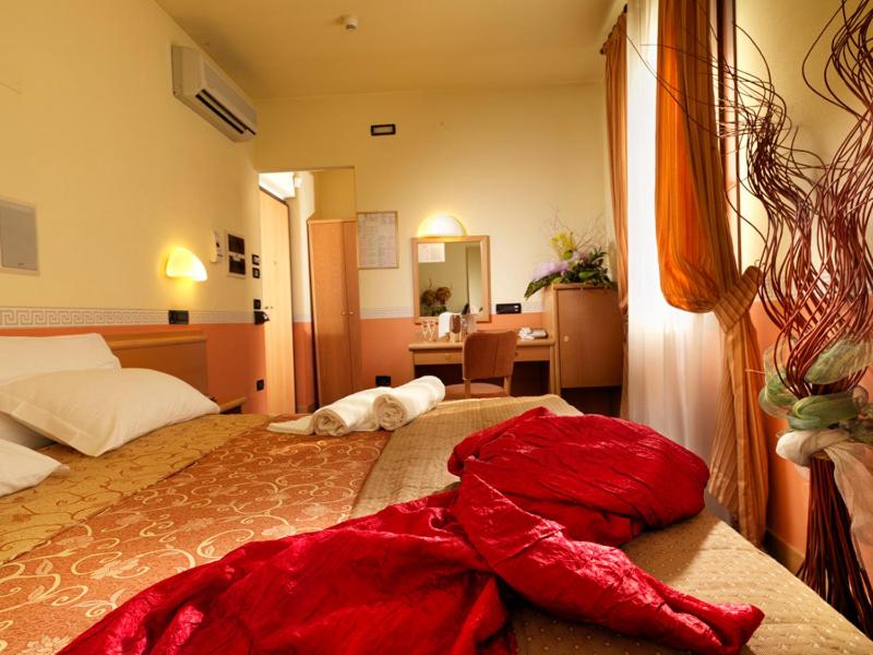 Postel nebo postele na pokoji v ubytování Hotel & Residence Roma