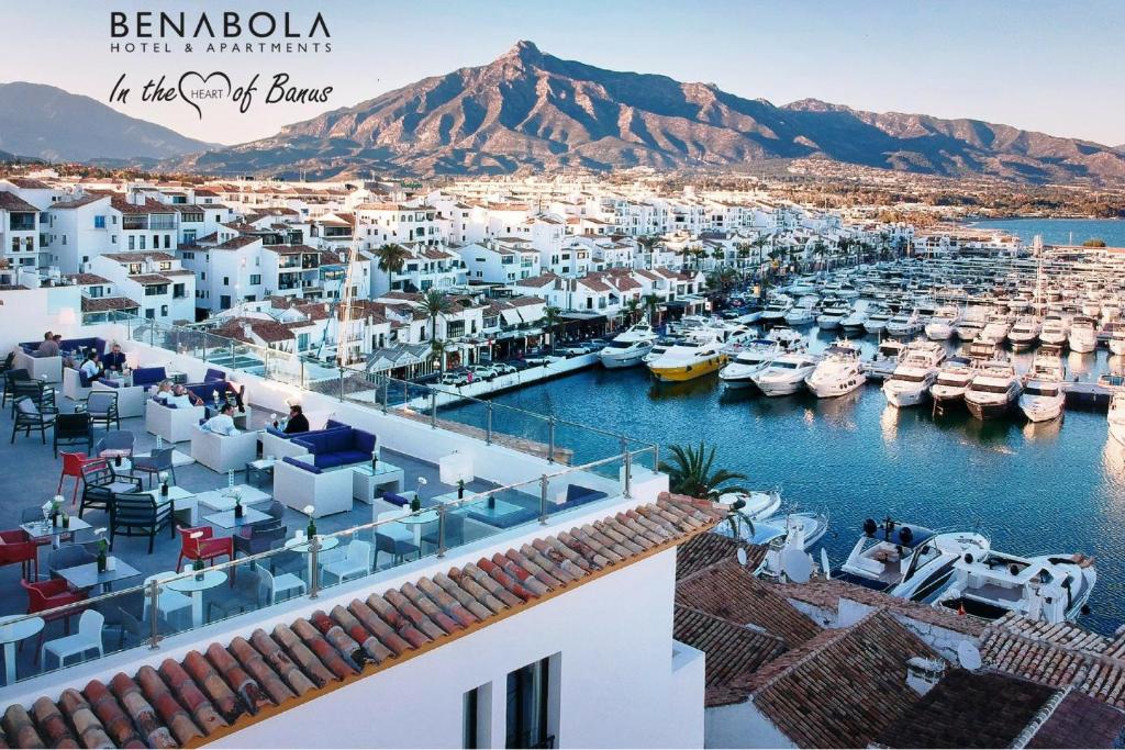 a view of a harbor with boats in the water at Benabola Hotel & Suites in Marbella