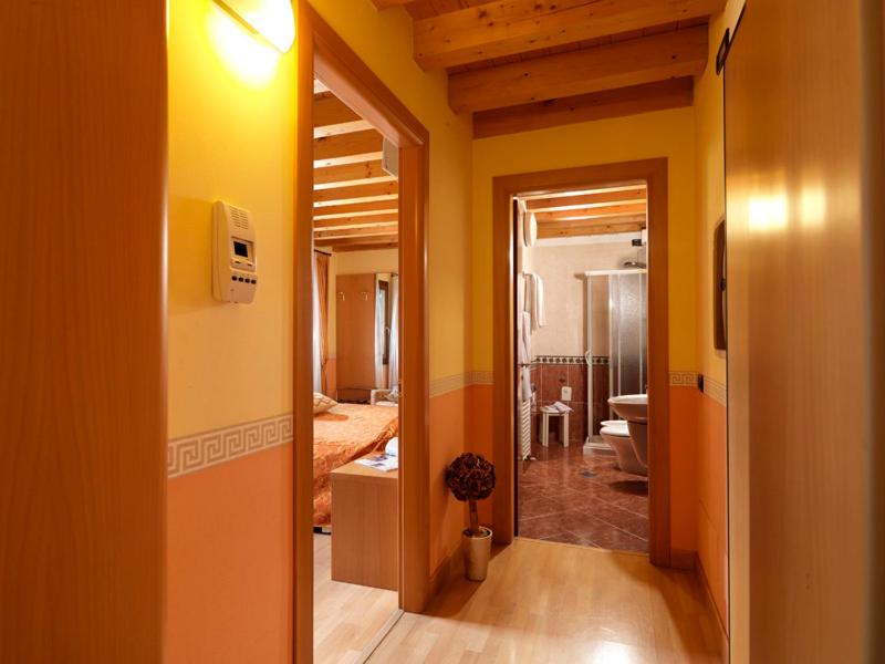 Postel nebo postele na pokoji v ubytování Hotel & Residence Roma