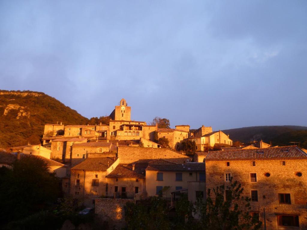 a group of buildings in a city at dusk at Les Hirondelles in Pont-de-Barret