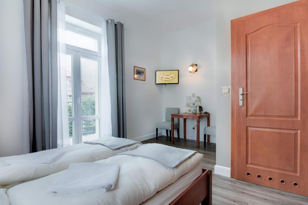 Posteľ alebo postele v izbe v ubytovaní Villa Venus