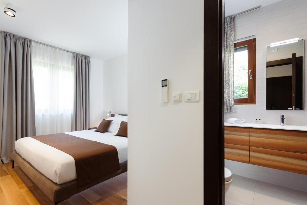 Posteľ alebo postele v izbe v ubytovaní Alba Residence