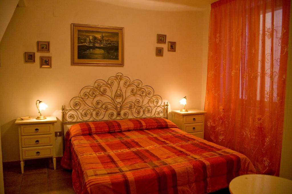 Łóżko lub łóżka w pokoju w obiekcie B&B Vecchia Alghero
