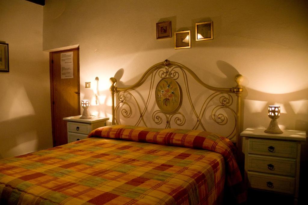 Łóżko lub łóżka w pokoju w obiekcie B&B Vecchia Alghero