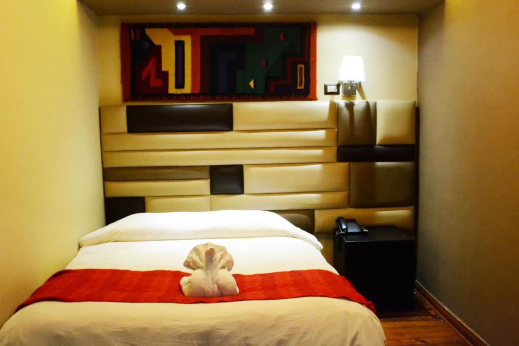 Letto o letti in una camera di Hotel Royal Qosqo