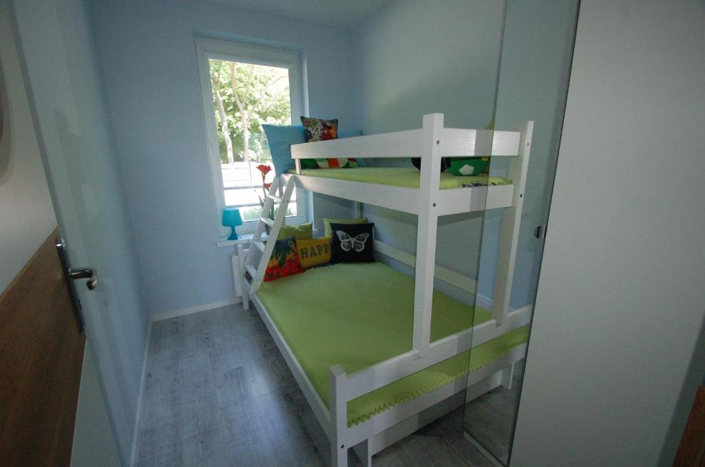 Posteľ alebo postele v izbe v ubytovaní M&K Apartamenty Zielony Zakątek - Sobieszewo