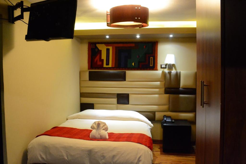 Letto o letti in una camera di Hotel Royal Qosqo