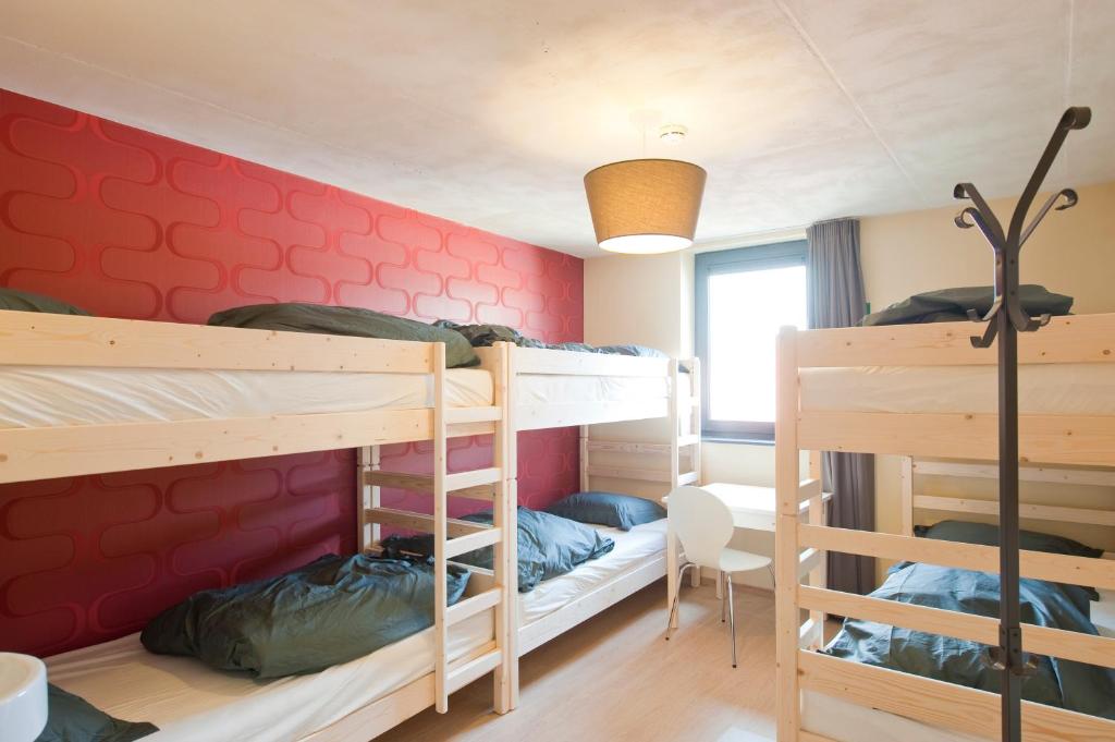 Postel nebo postele na pokoji v ubytování Leuven City Hostel