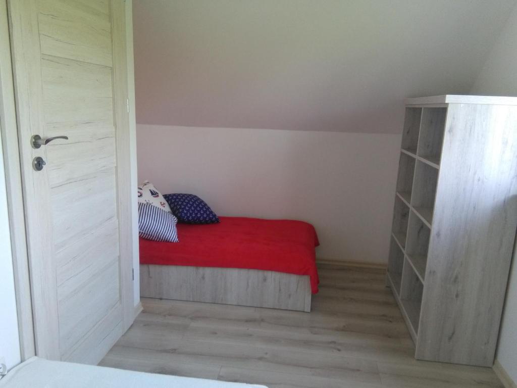 Postel nebo postele na pokoji v ubytování Domki Ancora - komfortowe domki nad morzem
