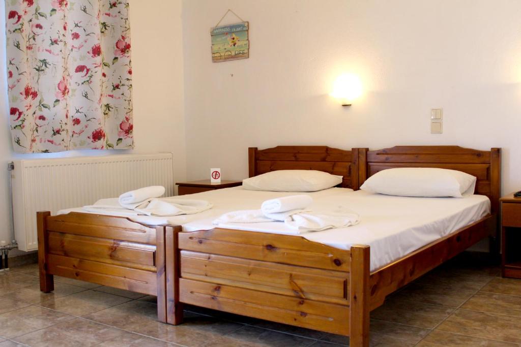 Postel nebo postele na pokoji v ubytování Adriani Inn